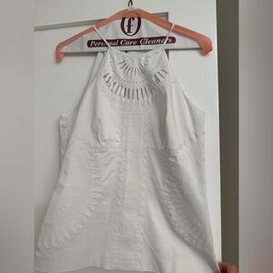 Karen Millen white top with back and side zipper. Excellent condition.